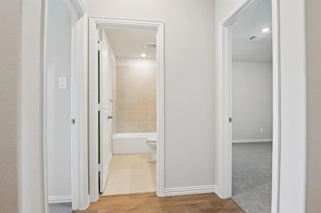 a kitchen with stainless steel appliances kitchen island granite countertop a stove a sink and a microwave