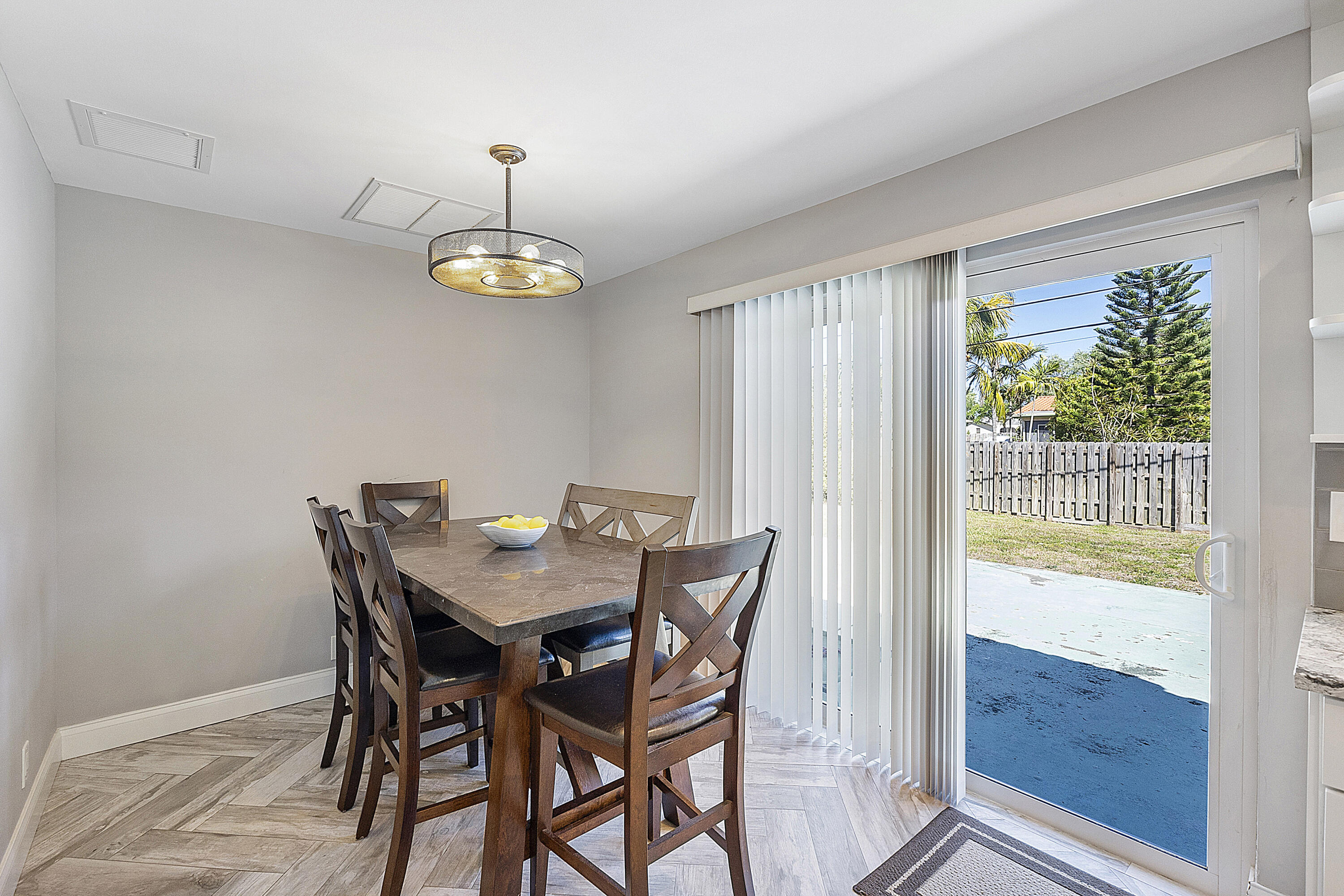 4064 Northwest 2nd Court Boca Raton, FL 33431 - Photo 46 of 57 a view of a dining room with furniture window and outside view