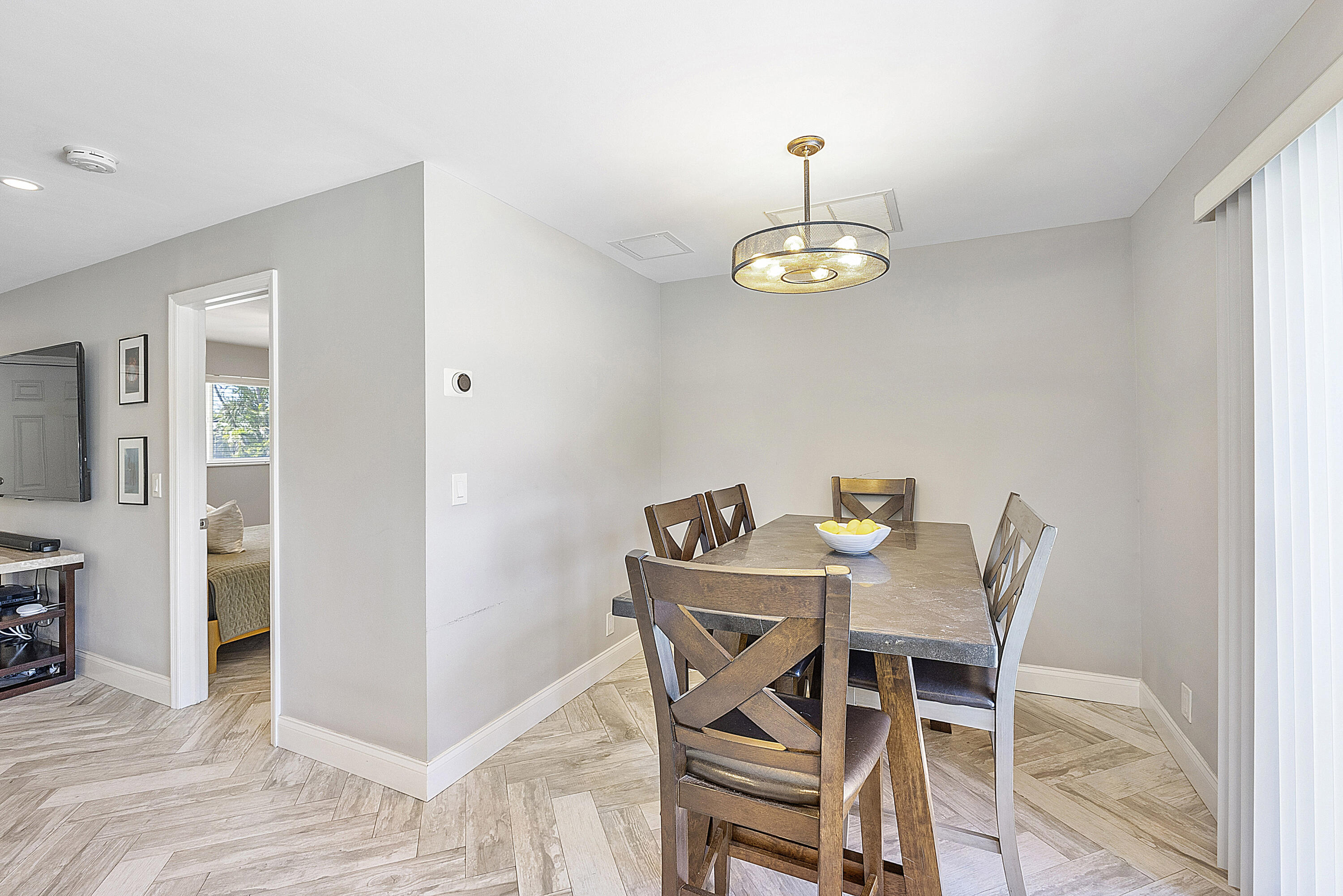 4064 Northwest 2nd Court Boca Raton, FL 33431 - Photo 47 of 57 a view of a dining room with a table and chairs
