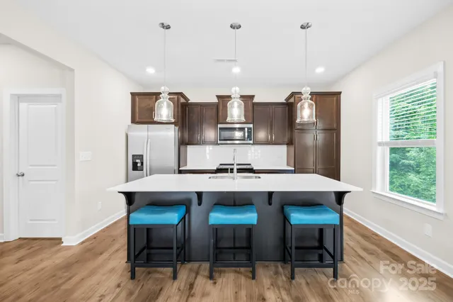 a kitchen with a table and chairs in it