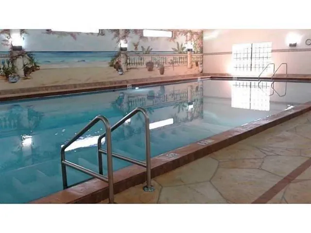 a kitchen with a table and chairs