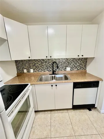 a bathroom with a bath tub with a shower