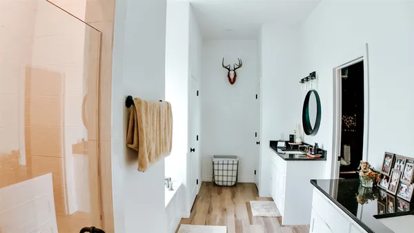 a bathroom with a bathtub and a shower