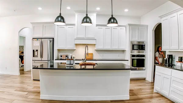 a bedroom with a bed and a couch