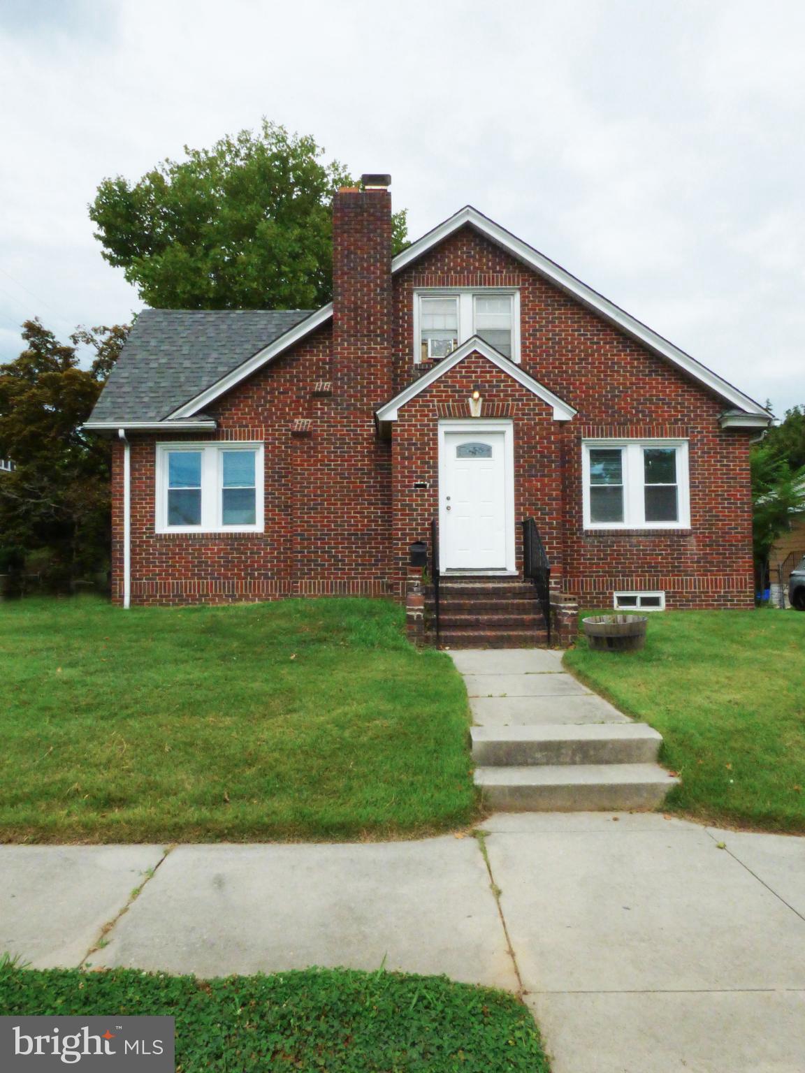 90 State Street, Unit 1 Penns Grove, NJ 08069 - Photo 2 of 21 a front view of a house with a yard