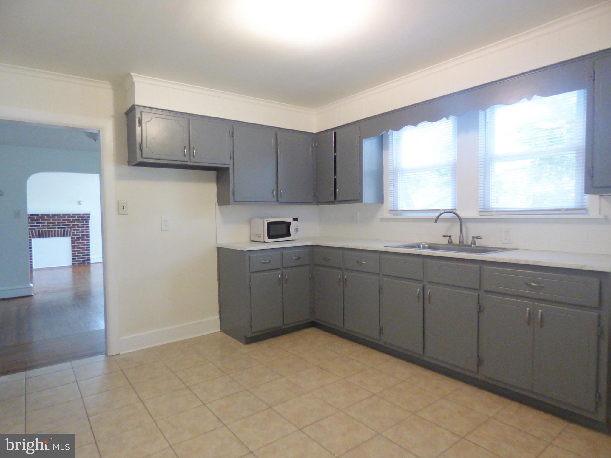 90 State Street, Unit 1 Penns Grove, NJ 08069 - Photo 8 of 21 a kitchen with a sink cabinets and window