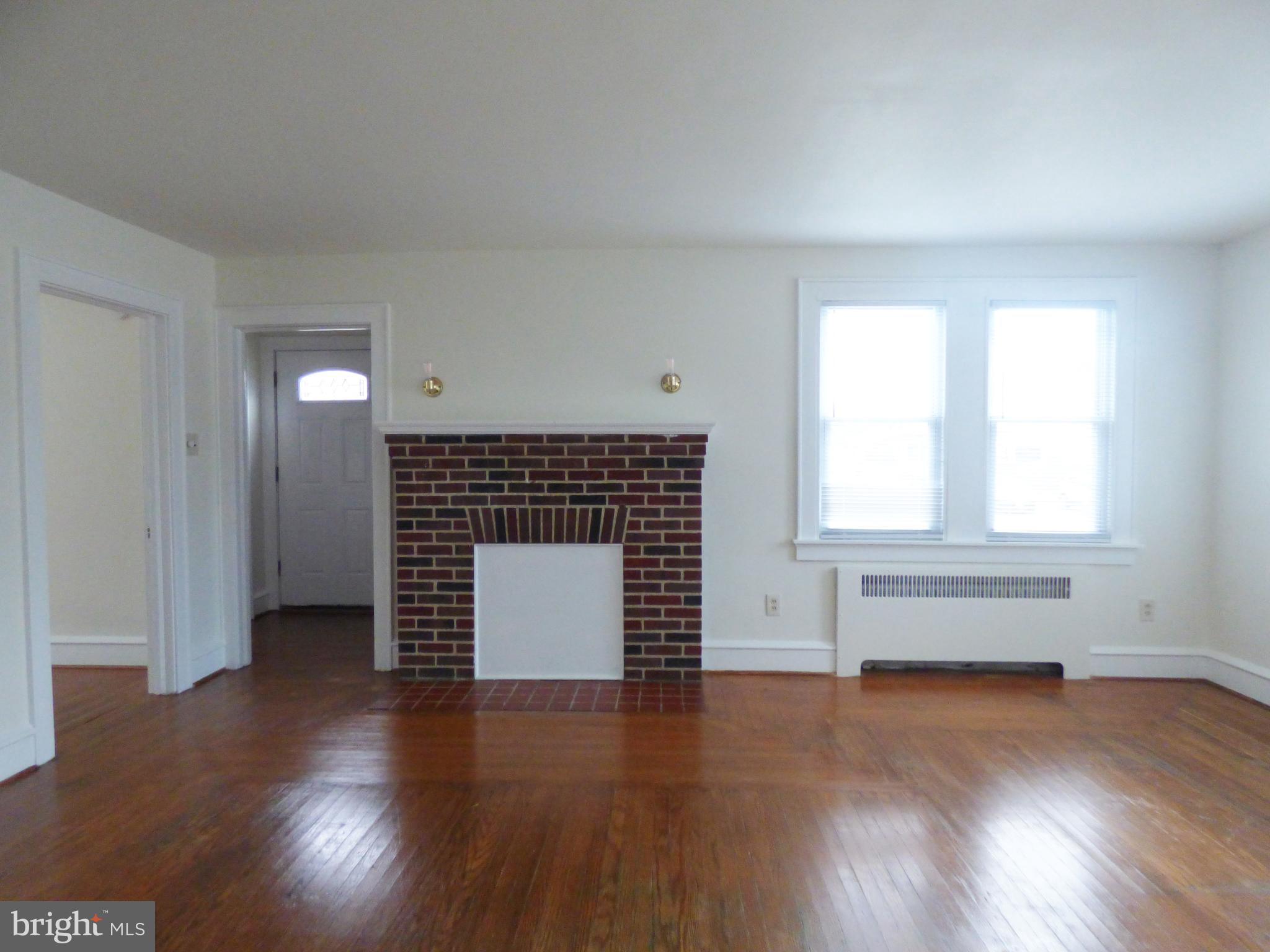 90 State Street, Unit 1 Penns Grove, NJ 08069 - Photo 10 of 21 an empty room with wooden floor and windows