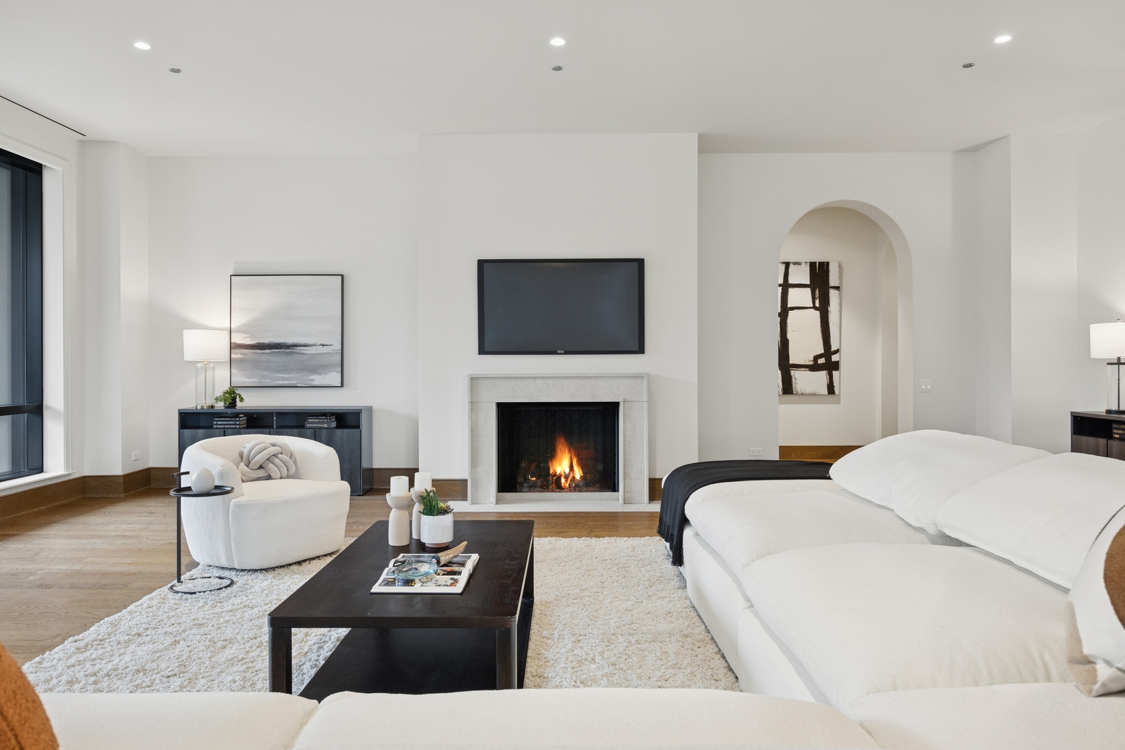 21 North May Street, Unit 402 Chicago, IL 60607 - Photo 16 of 63 a living room with furniture and a fireplace