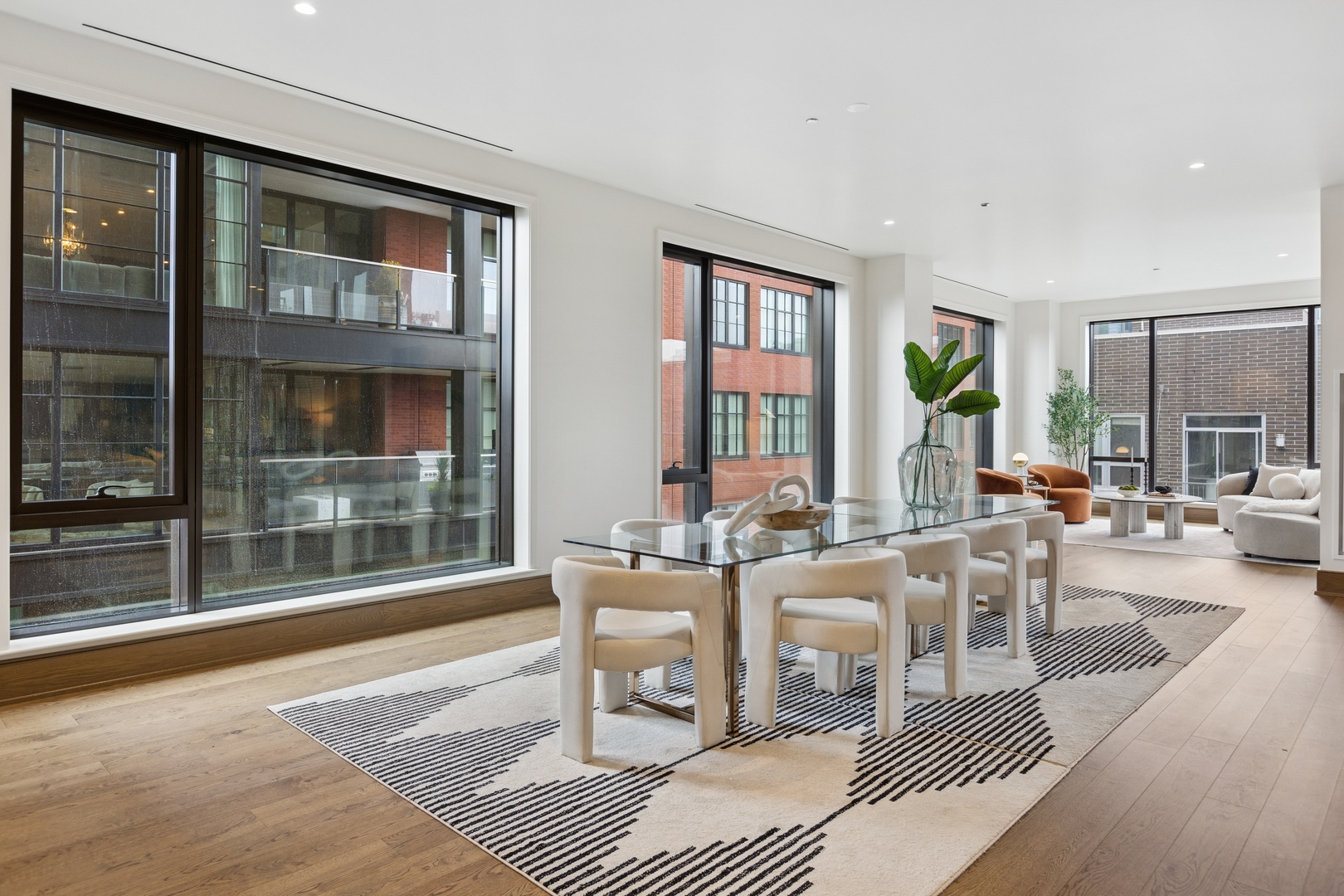 21 North May Street, Unit 402 Chicago, IL 60607 - Photo 20 of 63 a living room with furniture a window and a table