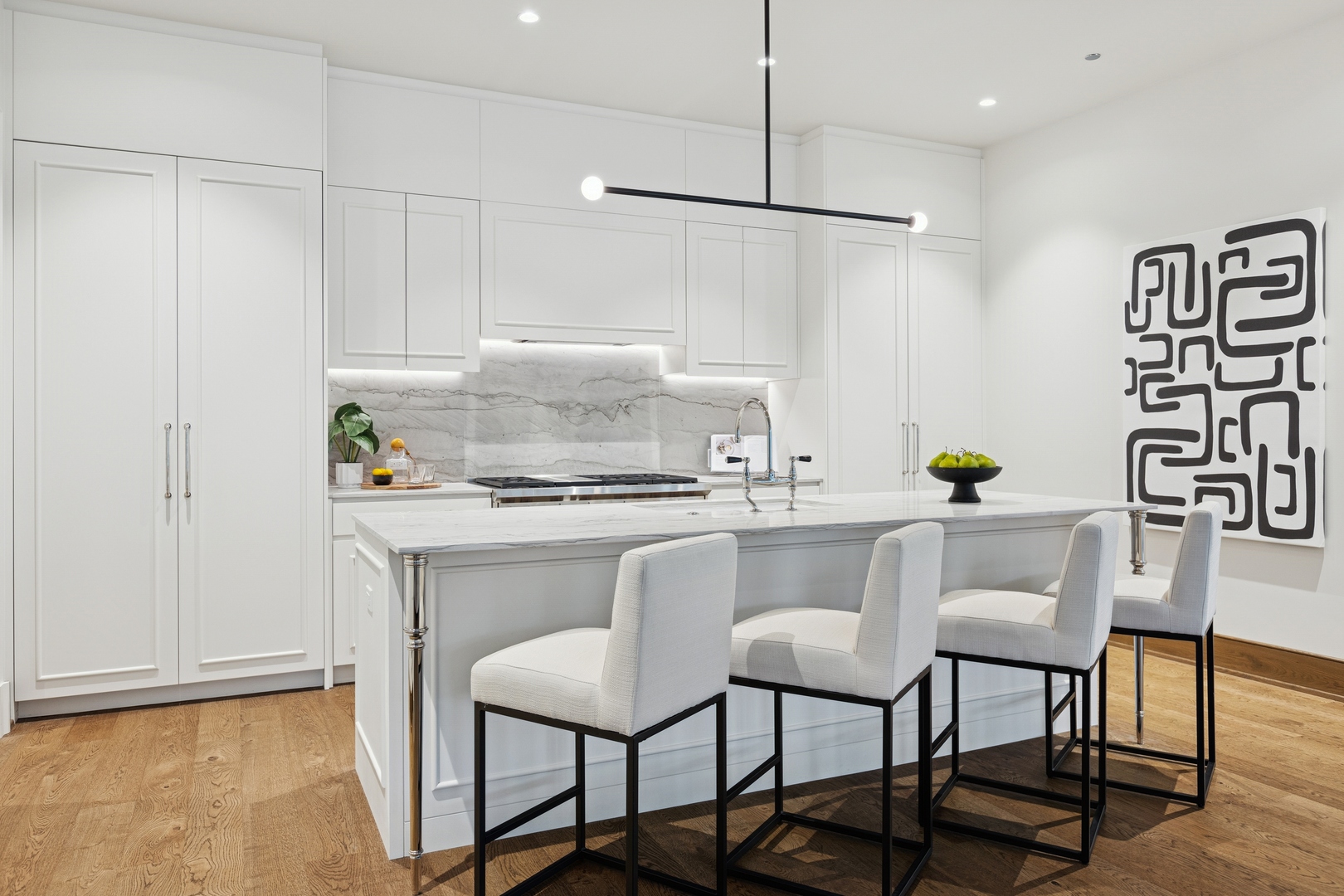 21 North May Street, Unit 402 Chicago, IL 60607 - Photo 31 of 63 a kitchen with stainless steel appliances granite countertop a table chairs and a refrigerator