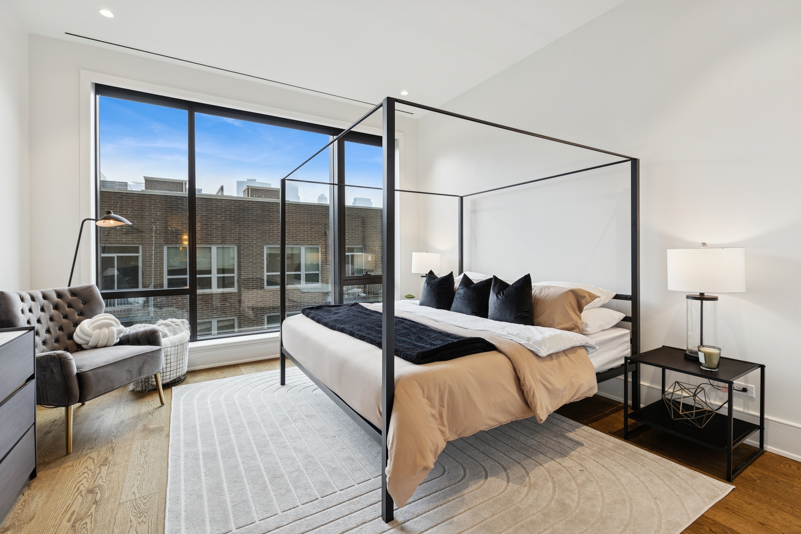 21 North May Street, Unit 402 Chicago, IL 60607 - Photo 37 of 63 a bedroom with a large bed and a large window