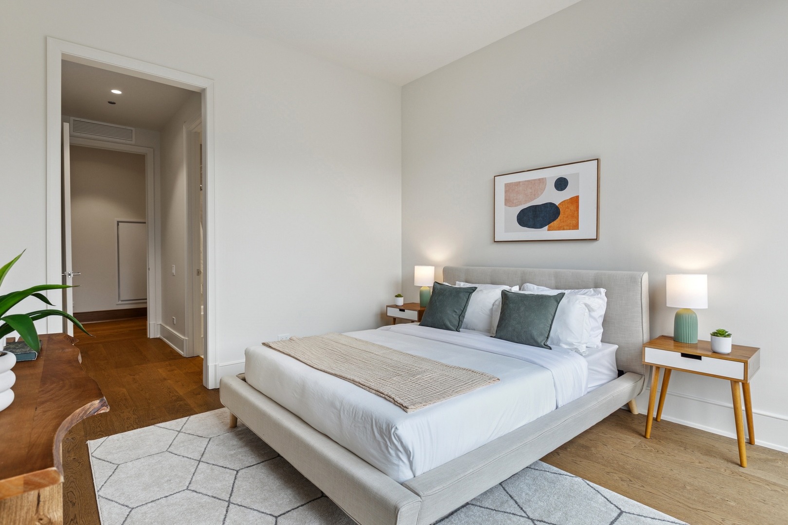 21 North May Street, Unit 402 Chicago, IL 60607 - Photo 50 of 63 a bedroom with a bed and a couch