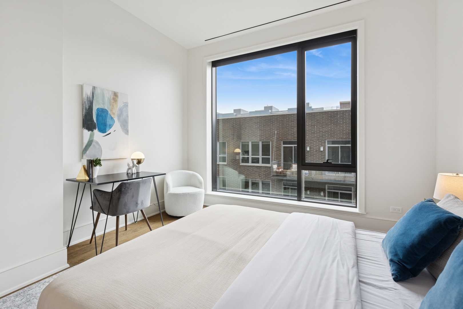 21 North May Street, Unit 402 Chicago, IL 60607 - Photo 53 of 63 a bedroom with a bed and window