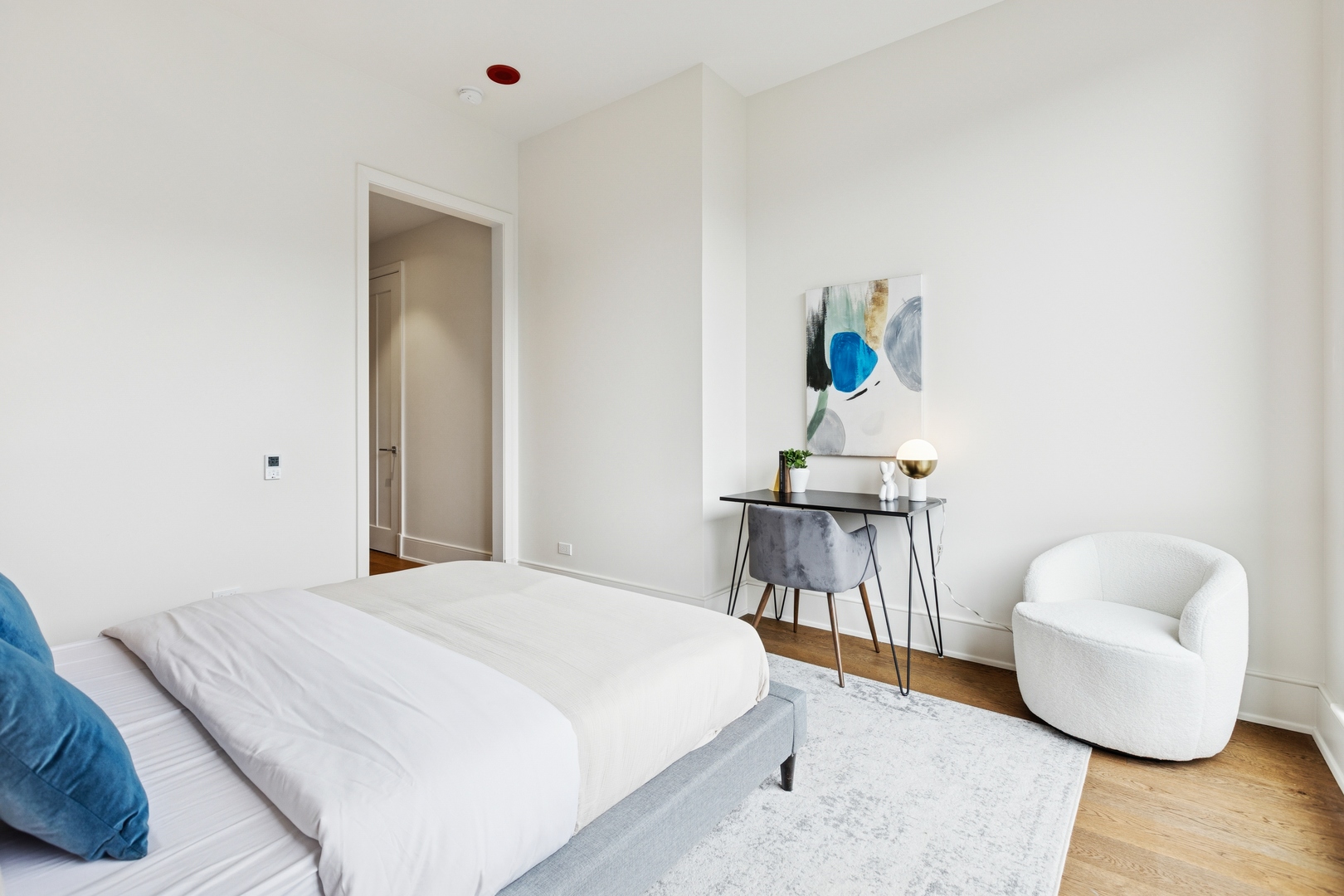 21 North May Street, Unit 402 Chicago, IL 60607 - Photo 55 of 63 a bedroom with a bed and a couch