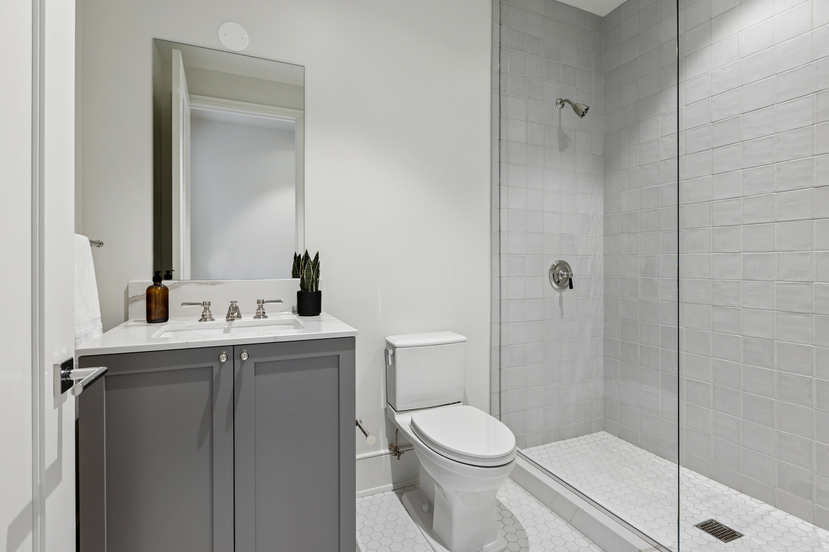 21 North May Street, Unit 402 Chicago, IL 60607 - Photo 56 of 63 a bathroom with a toilet a sink and shower