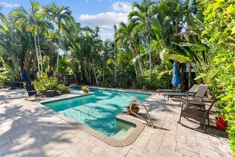 a sign that is in front of flowers