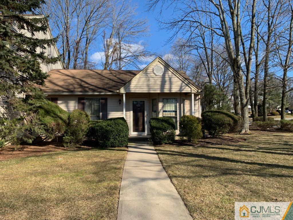 606 Maplecrest Road Edison, NJ 08820 - Photo 1 of 8 a front view of a house with a yard