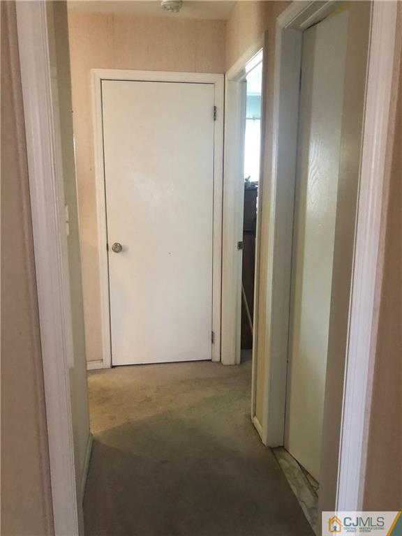 606 Maplecrest Road Edison, NJ 08820 - Photo 3 of 8 a view of an empty room with closet area