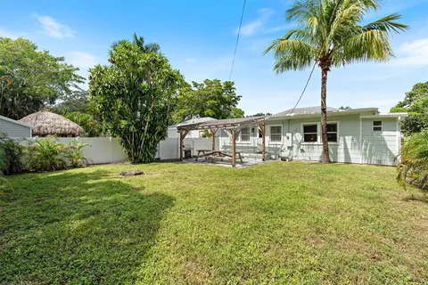 a front view of a house with garden and porch