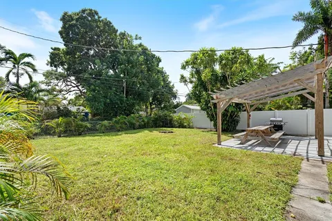 a view of a backyard with a patio