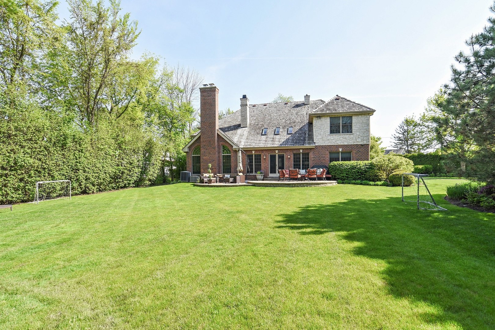 1085 Green Bay Road Glencoe, IL 60022 - Photo 23 of 24 a view of a house with a big yard and large trees