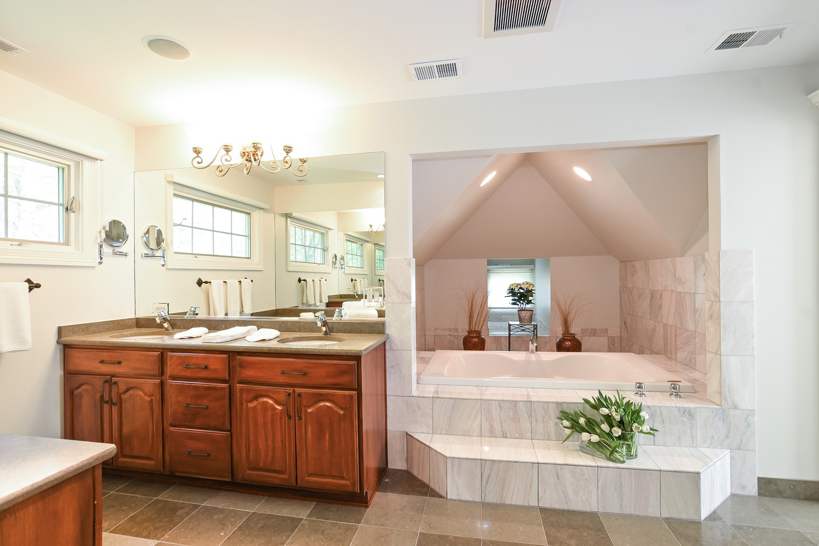 1085 Green Bay Road Glencoe, IL 60022 - Photo 10 of 24 a spacious bathroom with a granite countertop sink and a mirror
