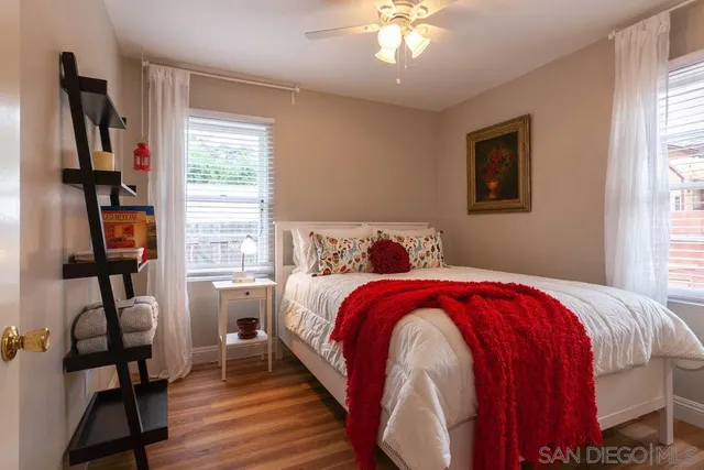 a bedroom with a bed and a desk