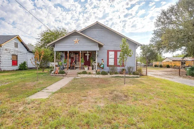 a swimming pool with outdoor seating and yard