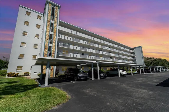 a view of building with parking space