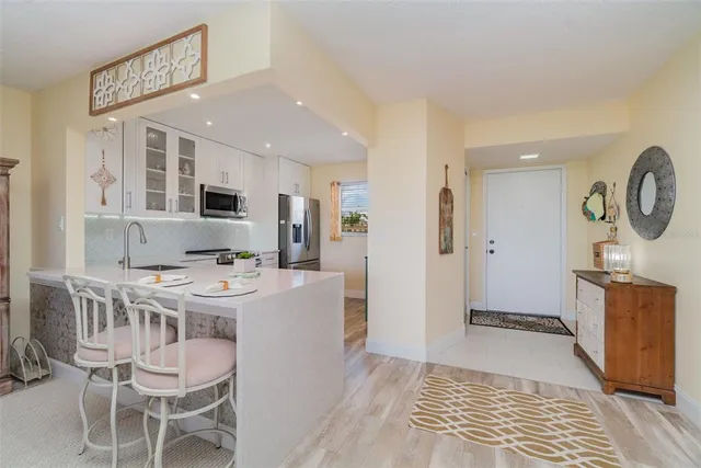 a very nice looking dining room with a table and chairs