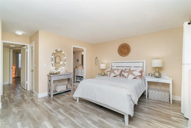 a bedroom with a bed and a table