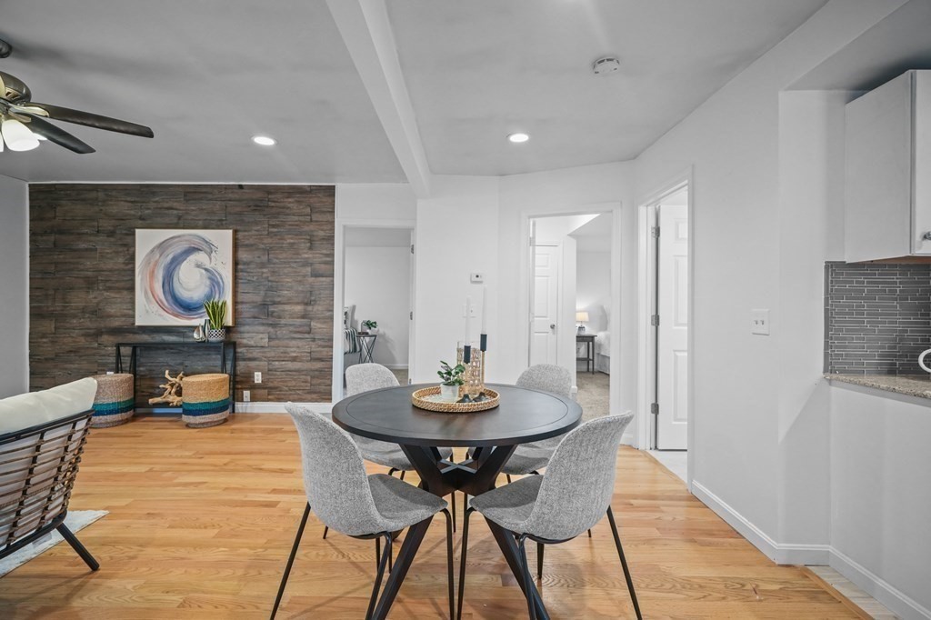1122 Wood Street Fall River, MA 02721 - Photo 12 of 39 a dining room with furniture and wooden floor