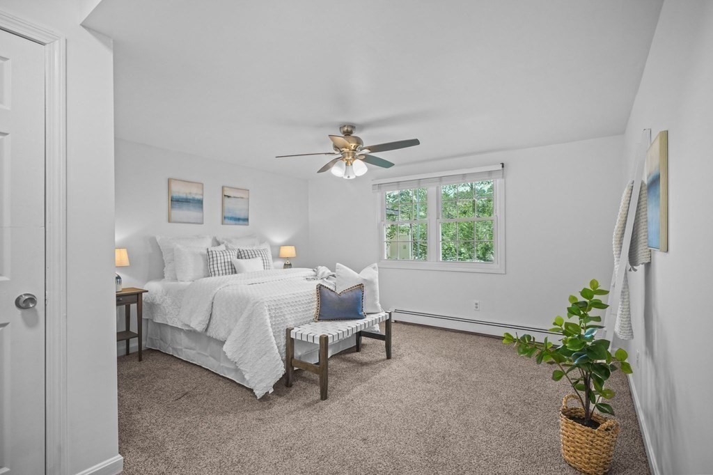 1122 Wood Street Fall River, MA 02721 - Photo 19 of 39 a bed room with a bed and a potted plant