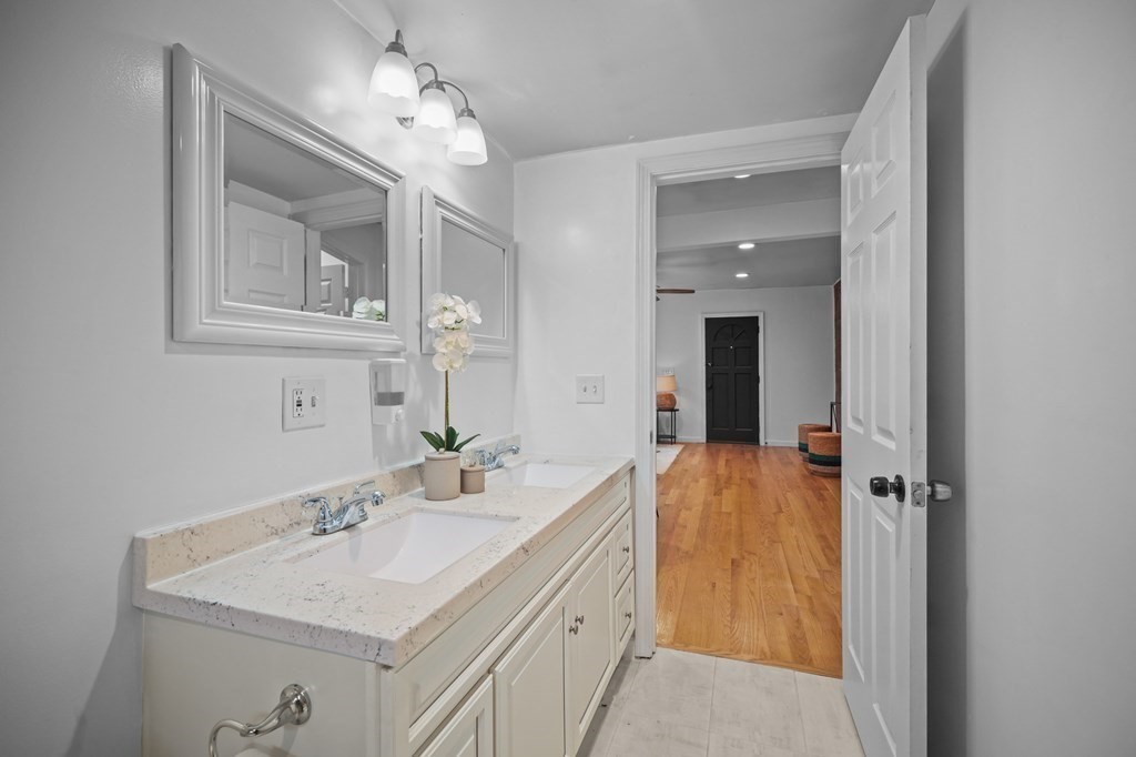 1122 Wood Street Fall River, MA 02721 - Photo 27 of 39 a bathroom with a sink vanity and mirror