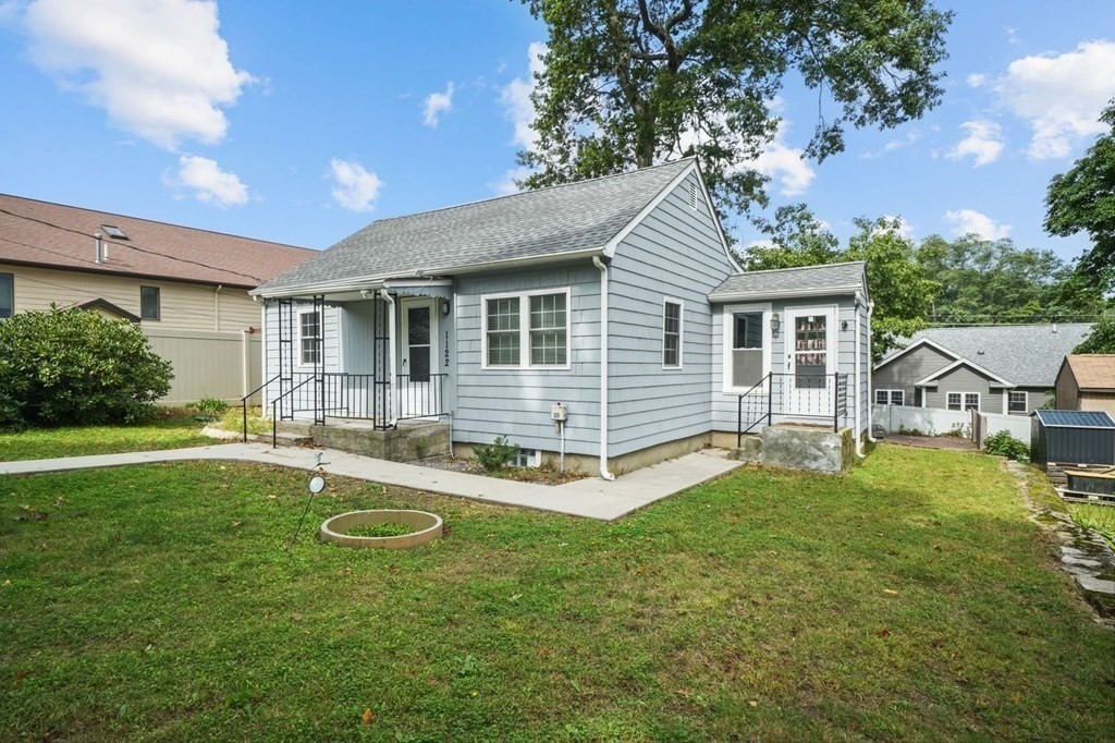 1122 Wood Street Fall River, MA 02721 - Photo 30 of 39 a view of a house with backyard and sitting area