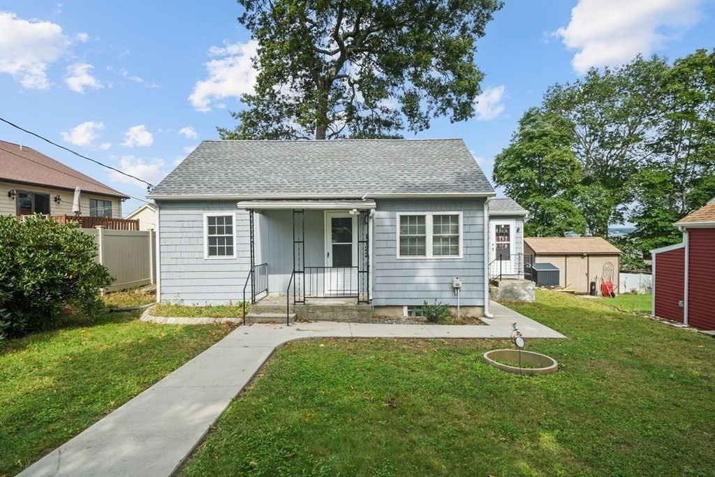 1122 Wood Street Fall River, MA 02721 - Photo 31 of 39 a backyard of a house with table and chairs