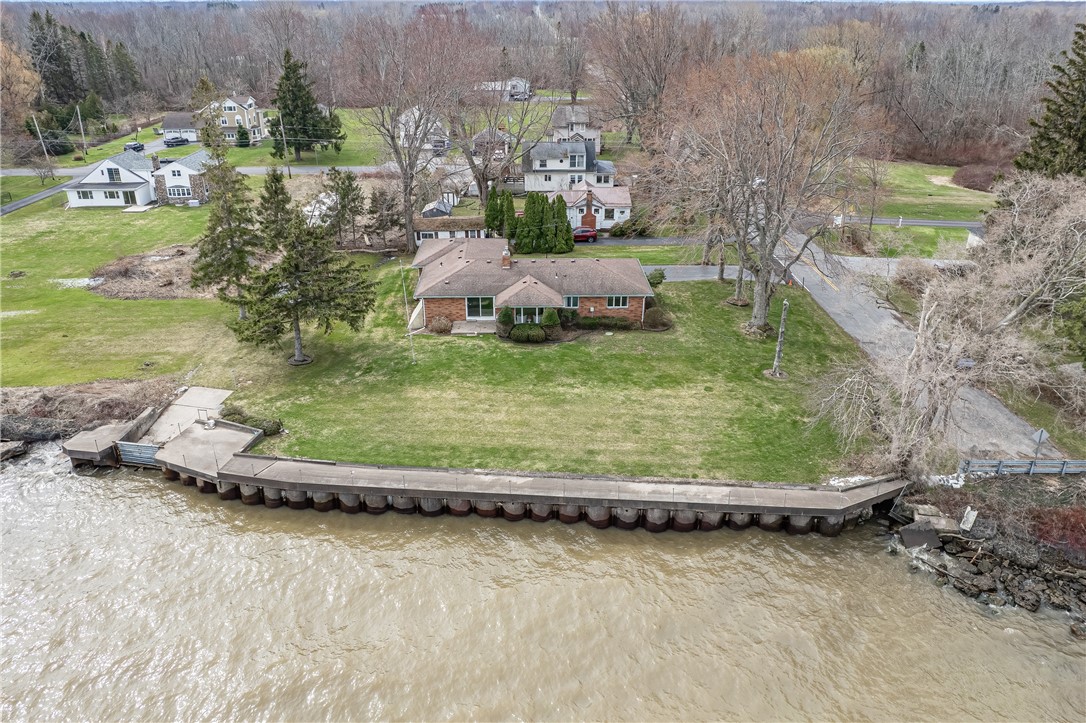 12 Lighthouse Road Parma, NY 14468 - Photo 2 of 49 Steel wall with concrete cap. There are tracks th