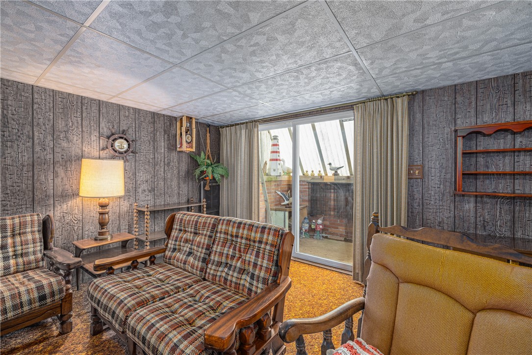 12 Lighthouse Road Parma, NY 14468 - Photo 25 of 49 Finished area of lower level has sliding glass doo