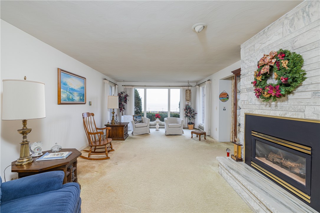 12 Lighthouse Road Parma, NY 14468 - Photo 5 of 49 This living room expands front to rear. The lake s