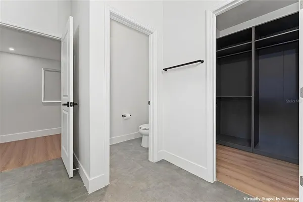 a bathroom with a toilet sink and shower
