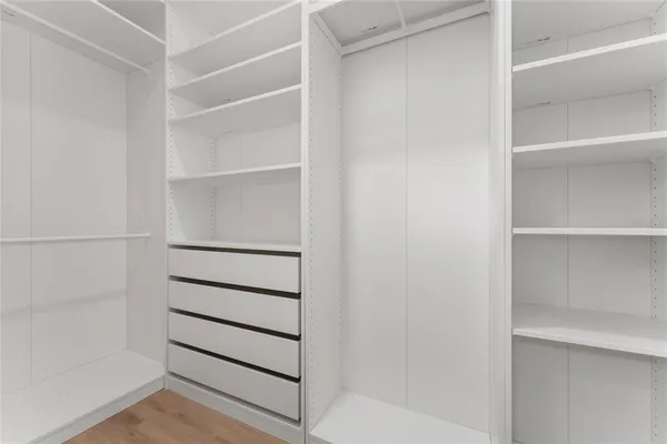 a view of empty room with floor to ceiling window and yard