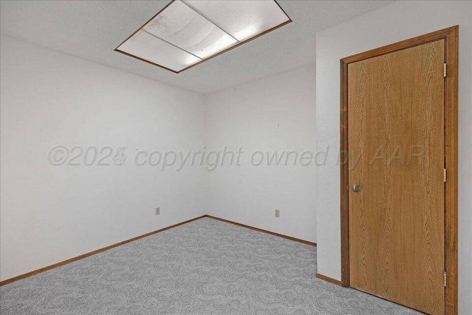 3900 Ozark Trail Amarillo, TX 79109 - Photo 12 of 15 an empty room with a door