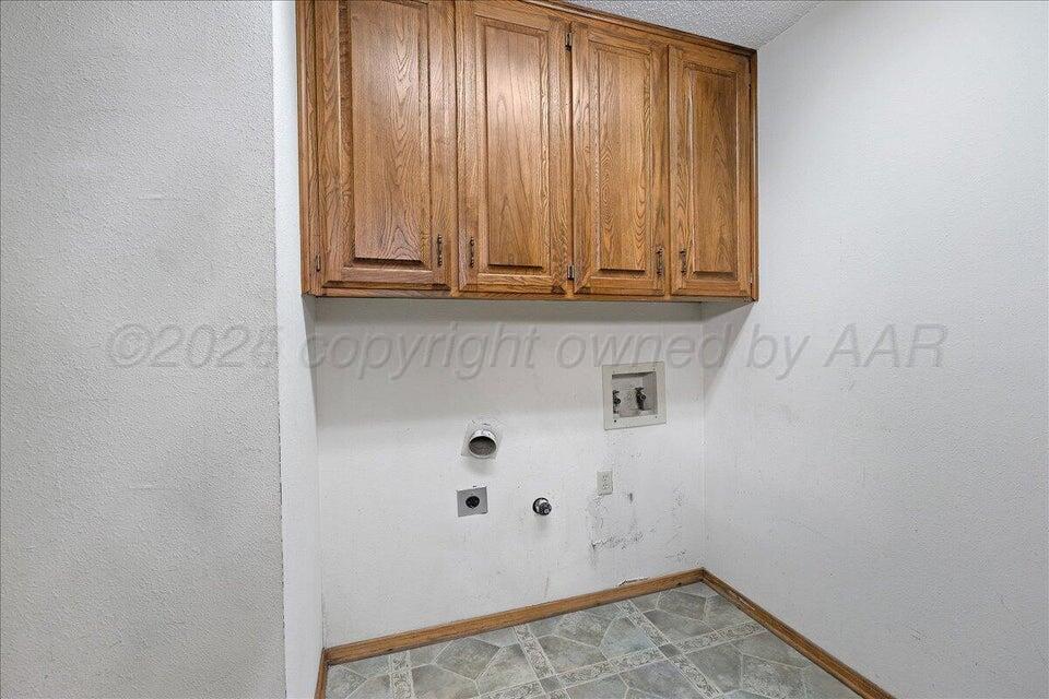 3900 Ozark Trail Amarillo, TX 79109 - Photo 13 of 15 a view of room with washer and dryer