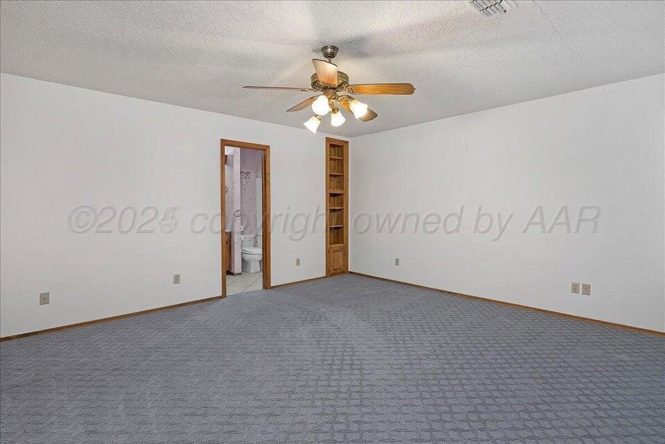 3900 Ozark Trail Amarillo, TX 79109 - Photo 6 of 15 a view of an empty room with a window