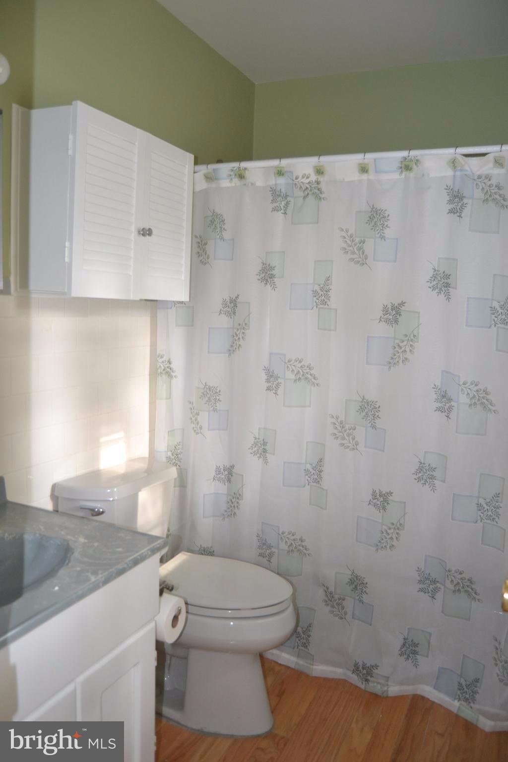 7943 Yellow Springs Road Frederick, MD 21702 - Photo 17 of 21 a bathroom with a granite countertop toilet and a sink