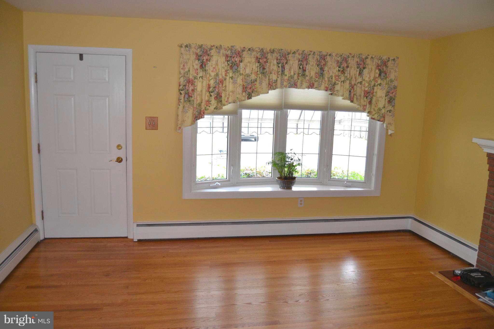 7943 Yellow Springs Road Frederick, MD 21702 - Photo 8 of 21 a view of a room with a window and wooden floor
