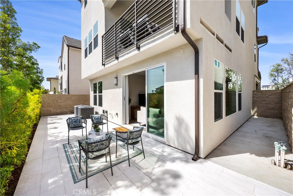 130 Pin Lane Lake Forest, CA 92630 - Photo 13 of 70 a view of a patio with couches table and chairs and potted plants