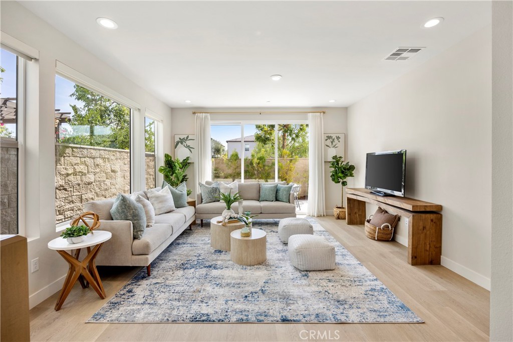 130 Pin Lane Lake Forest, CA 92630 - Photo 15 of 70 a living room with furniture a flat screen tv and a large window