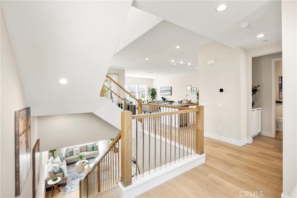 130 Pin Lane Lake Forest, CA 92630 - Photo 20 of 70 a view of a hallway with wooden floor and stairs