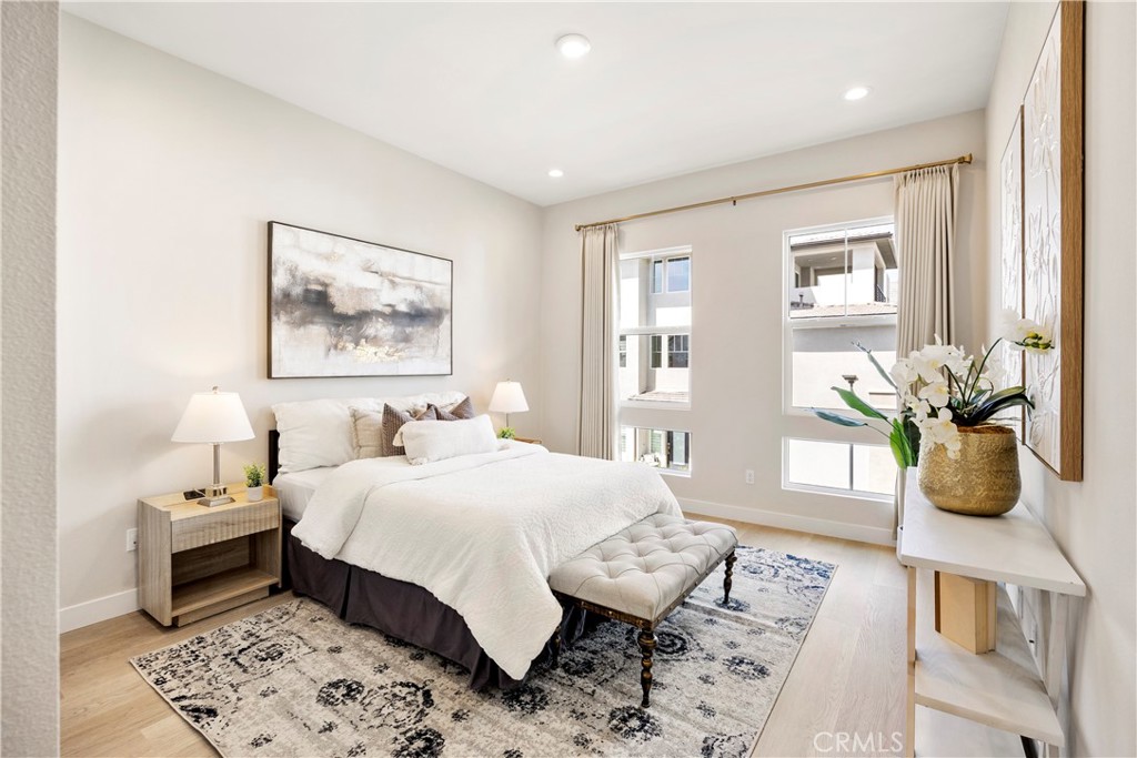 130 Pin Lane Lake Forest, CA 92630 - Photo 23 of 70 a bedroom with a bed a dresser and next to a window